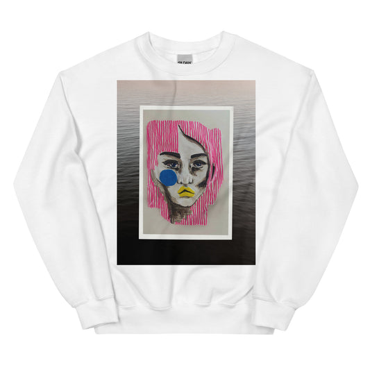 White sweatshirt featuring abstract portrait with pink hair, blue cheek accent, and yellow lips, set against a water background